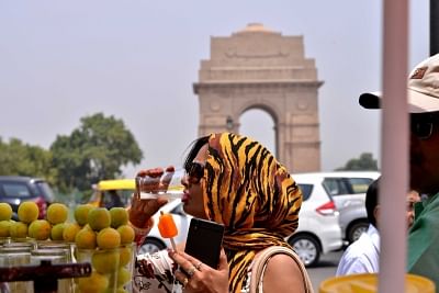 New Delhi: Women cover themselves to avoid scorching sun on a hot day in New Delhi on May 23, 2018. (Photo: IANS)