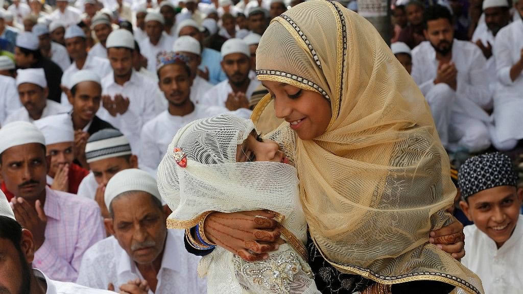 Children greet each other on Eid-ul-Fitr.