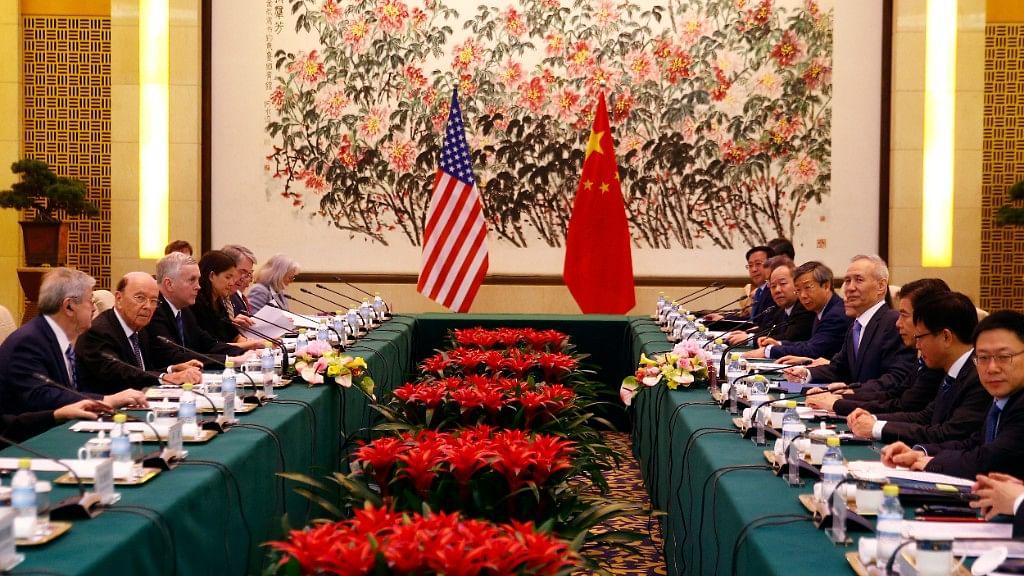 US Commerce Secretary Wilbur Ross, second from left, and Chinese Vice Premier Liu He, fourth right, attend a meeting at the Diaoyutai State Guesthouse in Beijing, Sunday, 3 June.