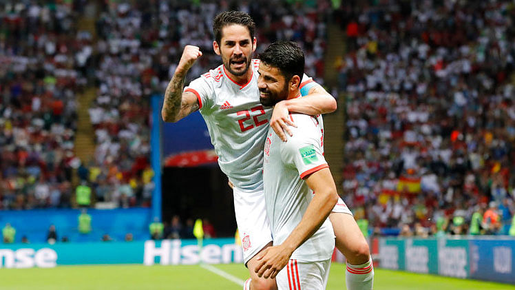 Spain’s Diego Costa, right, celebrates with Isco after scoring against Iran.