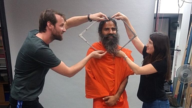 Yoga Guru Baba Ramdev giving measurements for his wax statue in London.&nbsp;