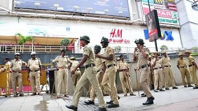 Security forces deployed ahead of the screening of Rajinikanth starrer Tamil film <i>Kaala</i> amid vociferous protests by pro-Kannada activists against his remarks on the Cauvery issue.