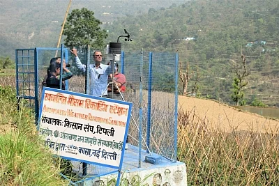 Residents of Tipli along with the experts monitor the micro weather grid.