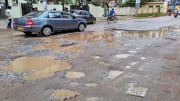 Potholes in Yelenahalli Road, Bengaluru.