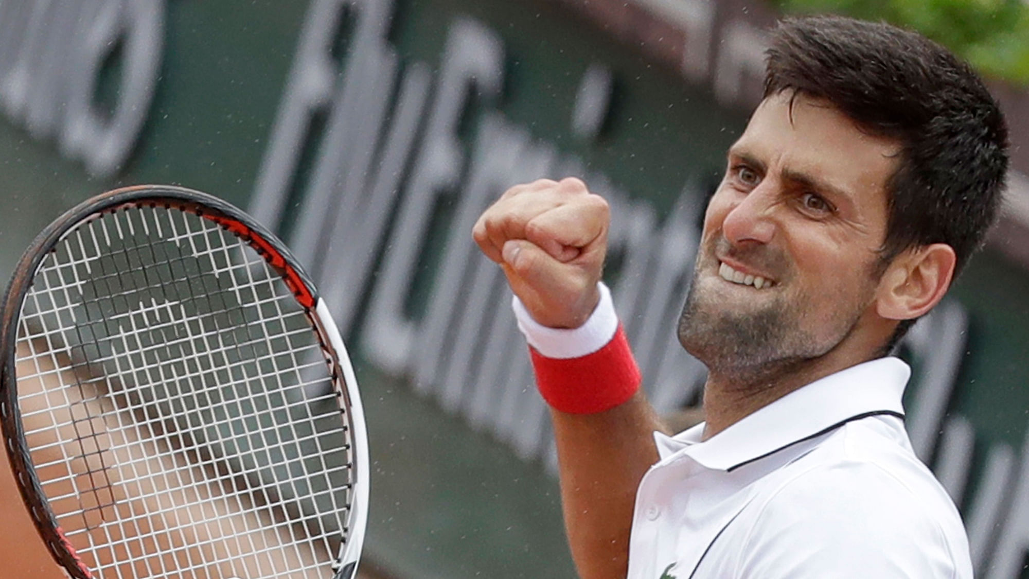 Serbia’s Novak Djokovic clenches his fist after scoring a point against Spain’s Roberto Bautista Agut during their third round match of the French Open.