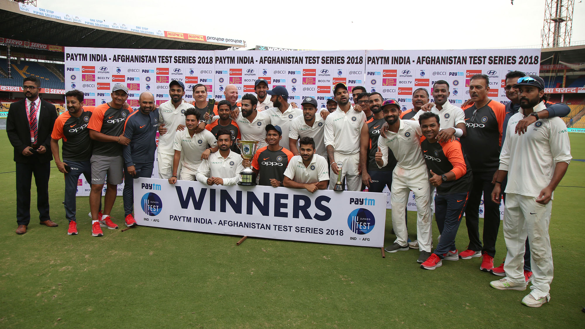 The Indian team poses with the trophy after beating Afghanistan in the only Test in Bengaluru on Friday.