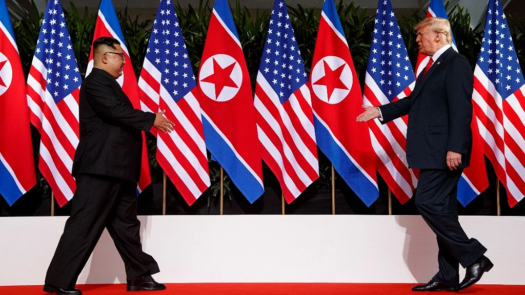 In this 12 June 2018 photo, US President Donald Trump meets with North Korean leader Kim Jong Un on Sentosa Island in Singapore.