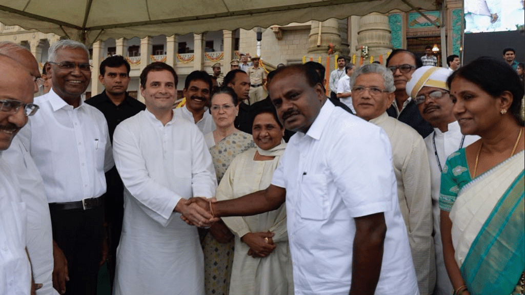 Rahul Gandhi shakes hands with new Karnataka Chief Minister HD Kumaraswamy.