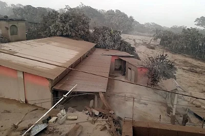 CHIMALTENANGO, June 4, 2018 (Xinhua) -- Photo taken on June 3, 2018, shows houses covered by ashes during the eruption of the "Volcan de Fuego", in Acatenango, Chimaltenango Department, Guatemala. At least seven people have been killed and 296 others injured in Guatemala as a highly active volcano near the country