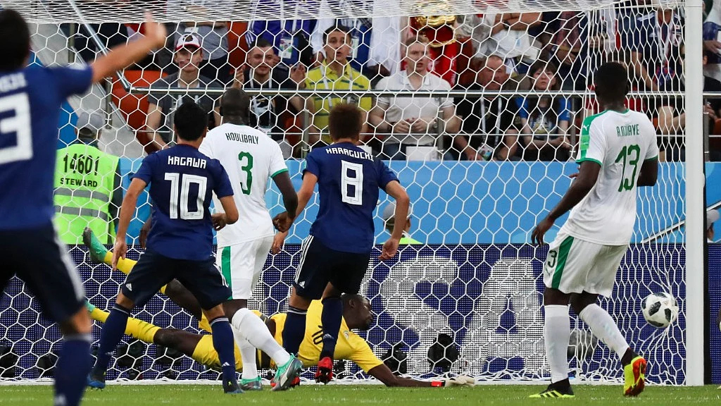 Senegal goalkeeper Khadim Ndiaye fails to stop a kick from Japan’s Takashi Inui during their Group H match at the Yekaterinburg Arena on Sunday.