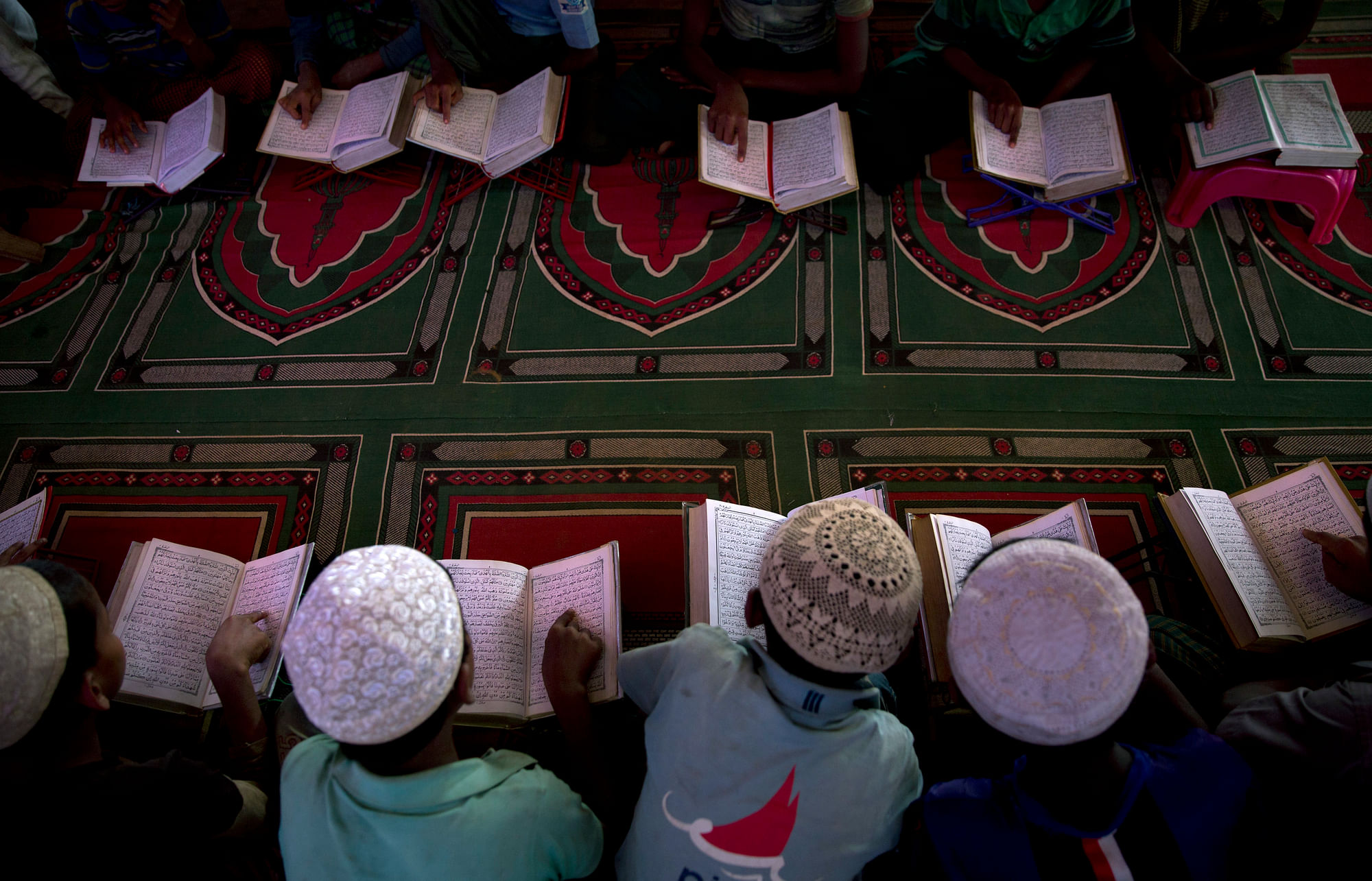 Rohingya children reading the Quran in a mosque