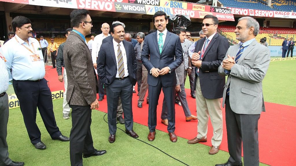 Union Sports Minister Rajyavardhan Singh Rathore with BCCI CEO Rahul Johri during Day One of the Test match between India and Afghanistan in Bengaluru  on 14 June.
