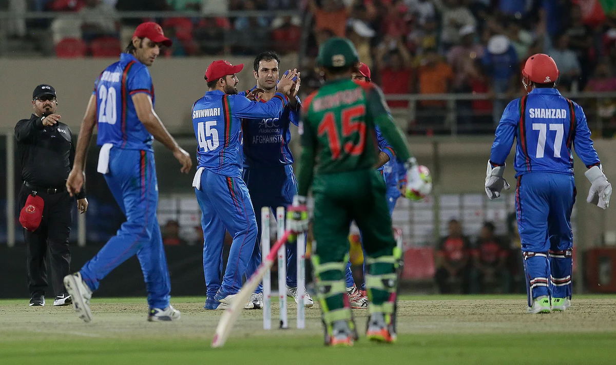 Afghanistan cricket players celebrate the wicket of Mushfiqur Rahim of Bangladesh during the first T20 cricket match between Afghanistan and Bangladesh.