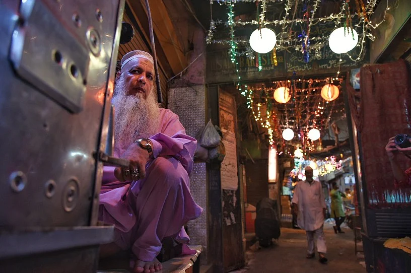 A shopkeeper awake since at 2 am, offering tea and coffee during sehri.