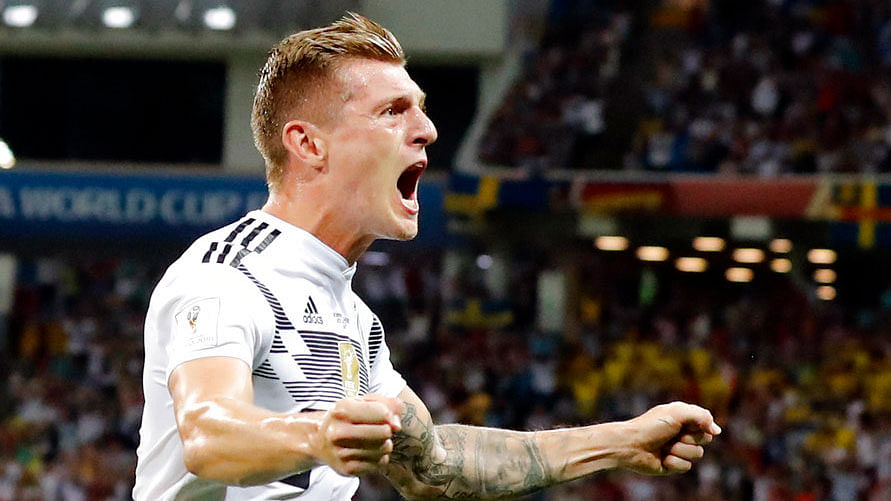 Germany’s Toni Kroos celebrates after he scored his side’s second goal during the group F match against Sweden.