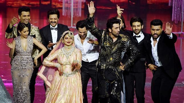 Younger stars show their love, respect and awe for veteran actor Rekha on stage after her performance at the 2018 IIFA Awards.