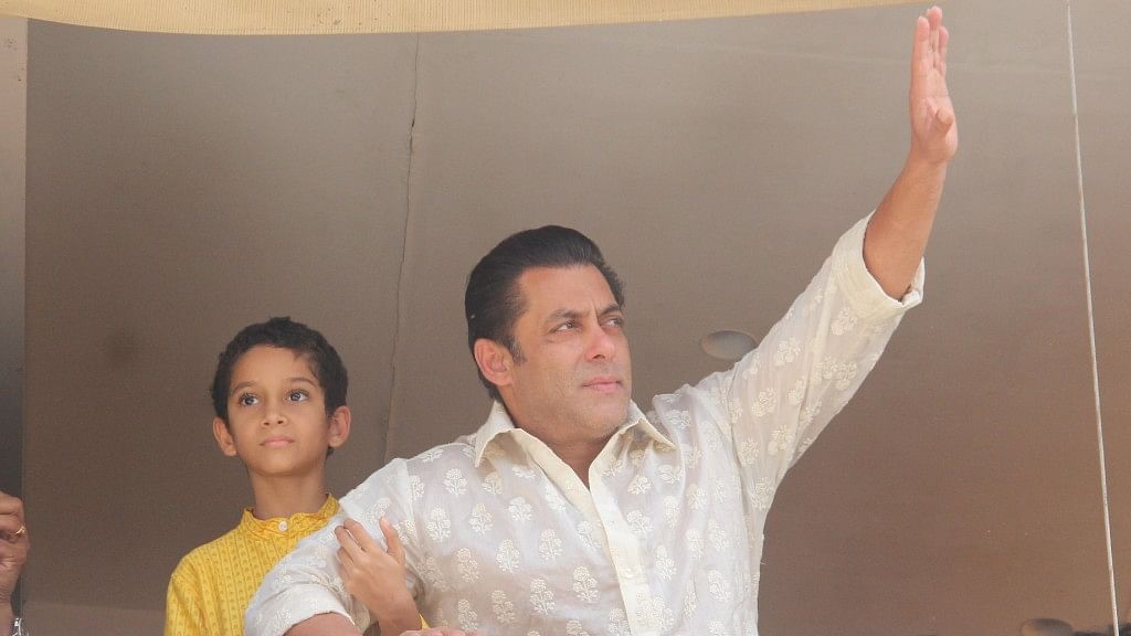 Salman Khan waves to his fans waiting outside his apartment.