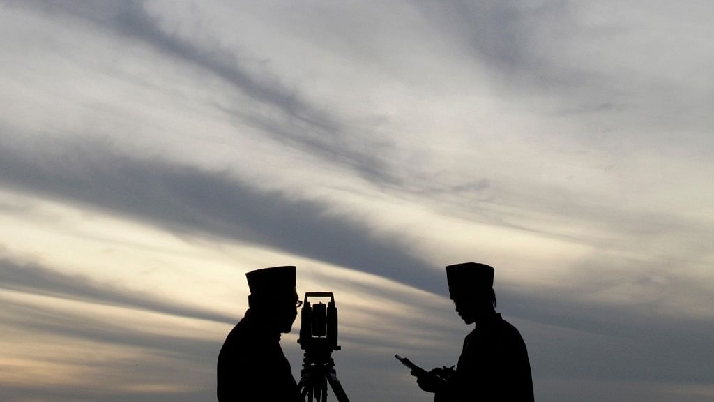 Officers of Malaysia’s Islamic authority sight the new moon of Ramadan, in Putrajaya outside Kuala Lumpur on 10 August, 2010.