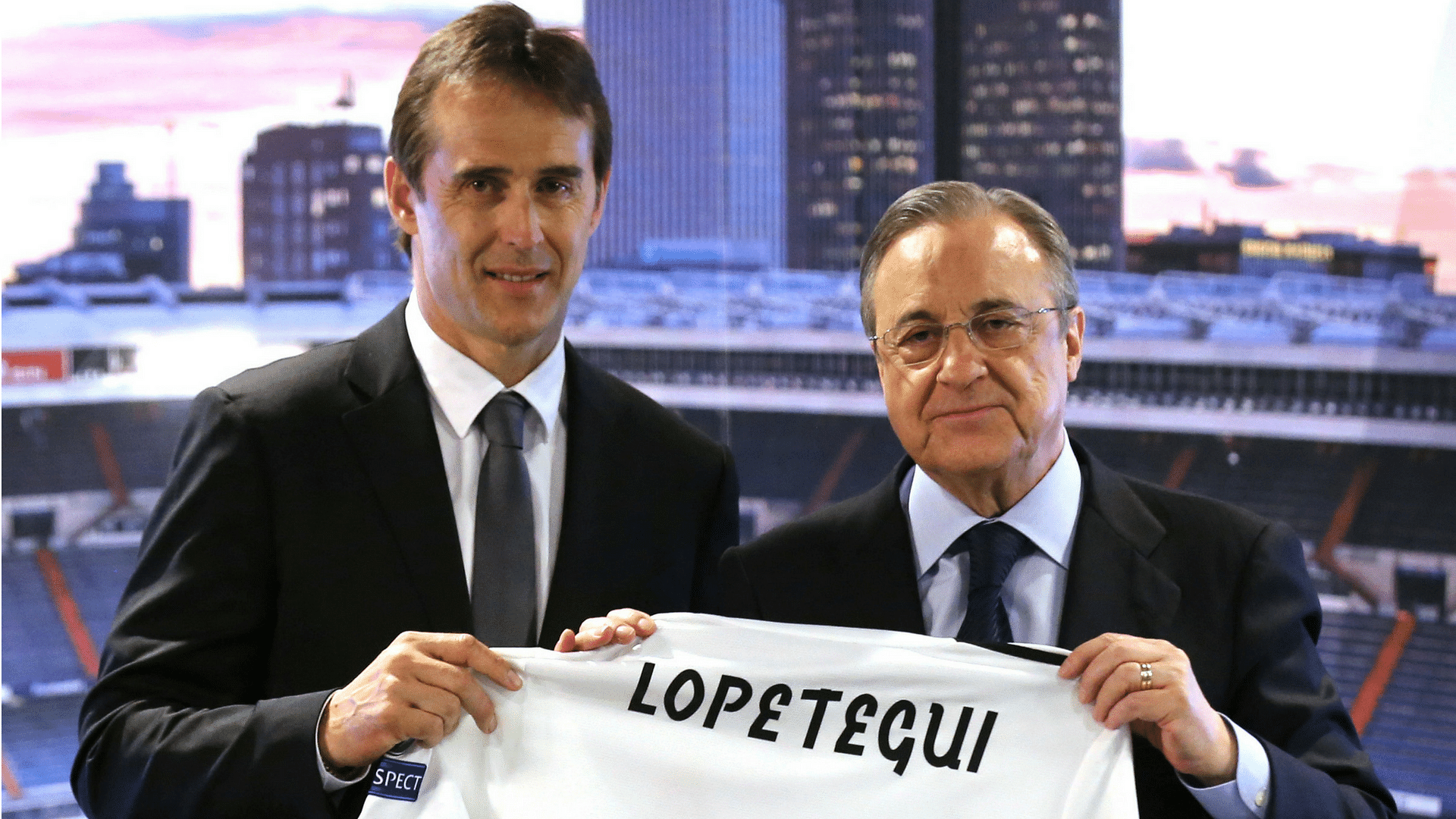 New coach Julen Lopetegui is presented a club shirt by Real Madrid President Florentino Perez.
