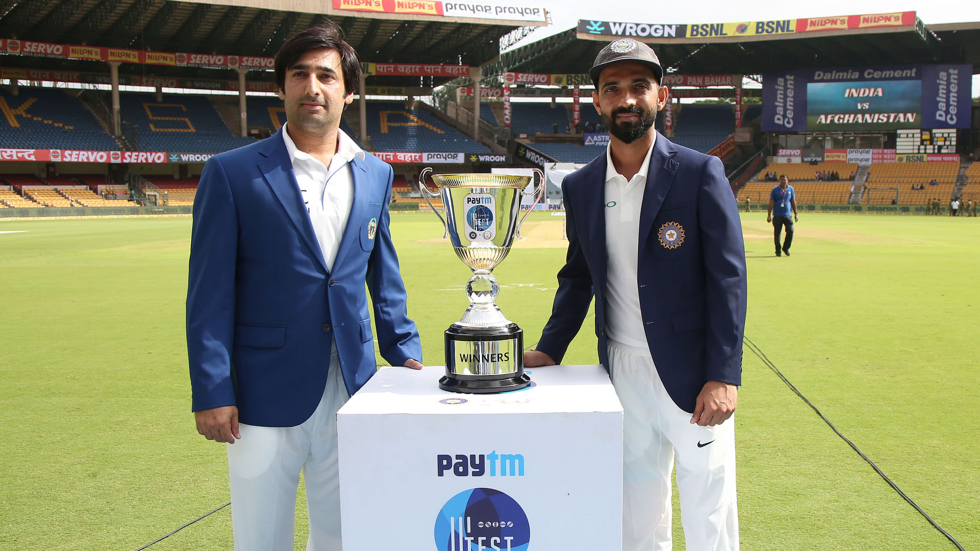 Indian captain Ajinkya Rahane and Afghanistan captain Asghar Stanikzai during day one of the Test match between India and Afghanistan held at the M Chinnaswamy Stadium in Bengaluru on Thursday,  14 June.