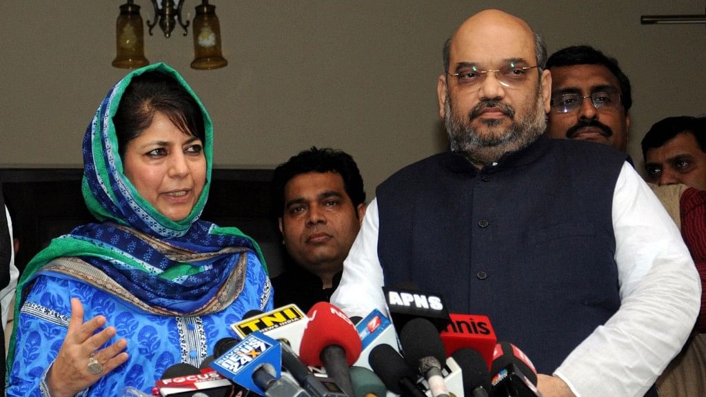 PDP President Mehbooba Mufti with BJP President Amit Shah.&nbsp;