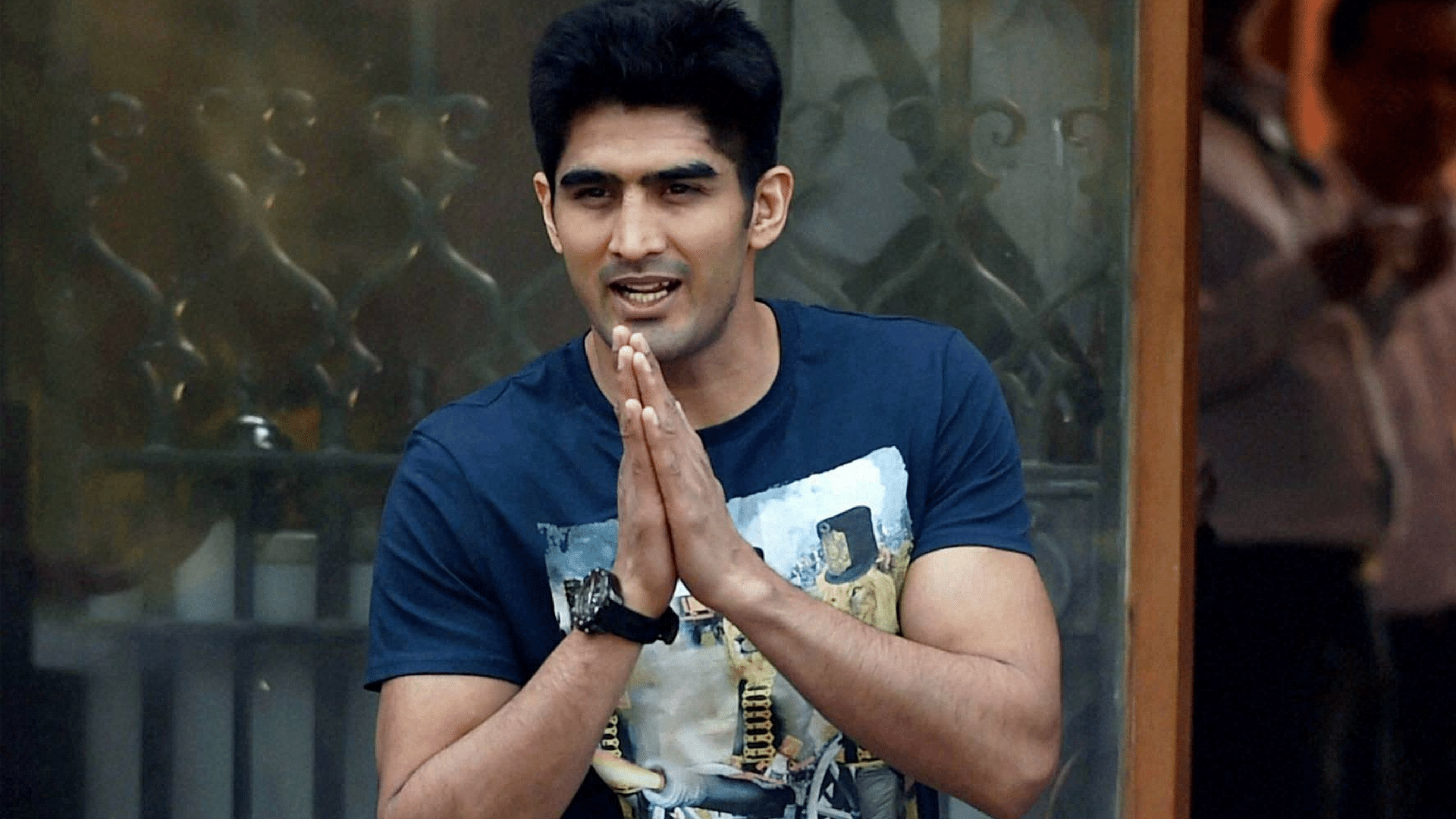 Olympian-turned-professional boxer Vijender Singh greets well-wishers and the press