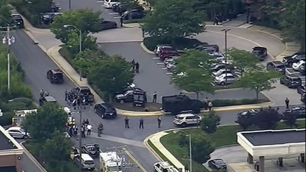 In this frame from video, people leave the Capital Gazette newspaper after multiple people have been shot on Thursday, 28 June, 2018, in Annapolis