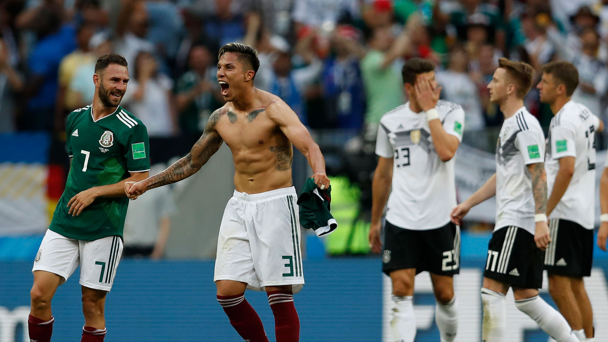 Mexico’s Carlos Salcedo, second left, and Miguel Layun, left, react after Mexico defeated Germany.