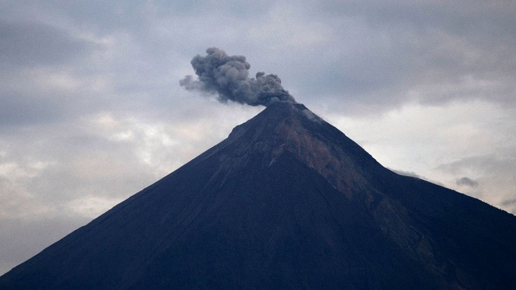 The Volcan de Fuego, or “Volcano of Fire,” blows a cloud of ash in Escuintla, Guatemala, Thursday, June 7, 2018. 
