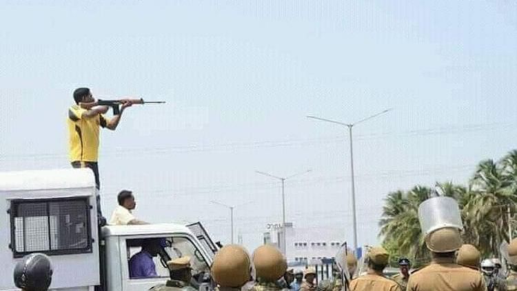 Police personnel firing at protesters at Thoothukudi.