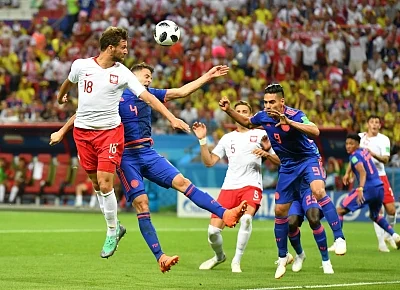KAZAN, June 24, 2018 (Xinhua) -- Bartosz Bereszynski (1st L) of Poland competes for a header with Santiago Arias (2nd L) of Colombia during the 2018 FIFA World Cup Group H match between Poland and Colombia in Kazan, Russia, June 24, 2018. (Xinhua/Lui Siu Wai/IANS)
