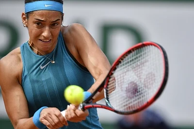 PARIS, June 4, 2018 (Xinhua) -- Caroline Garcia of France returns a shot during the women