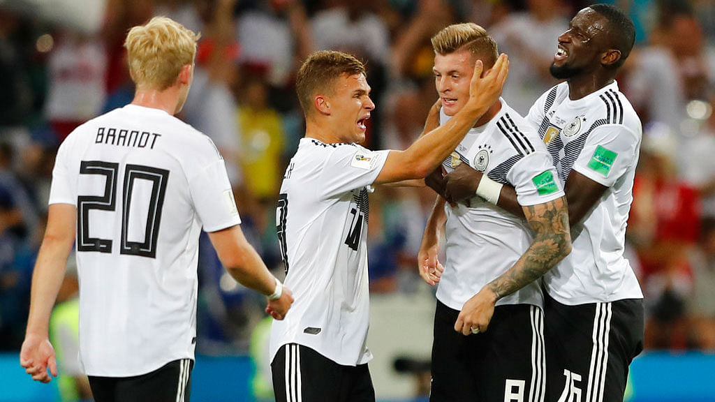 From left, Germany’s Julian Brandt, Joshua Kimmich, Toni Kroos and Antonio Ruediger celebrate their team’s 2-1 victory against Sweden.