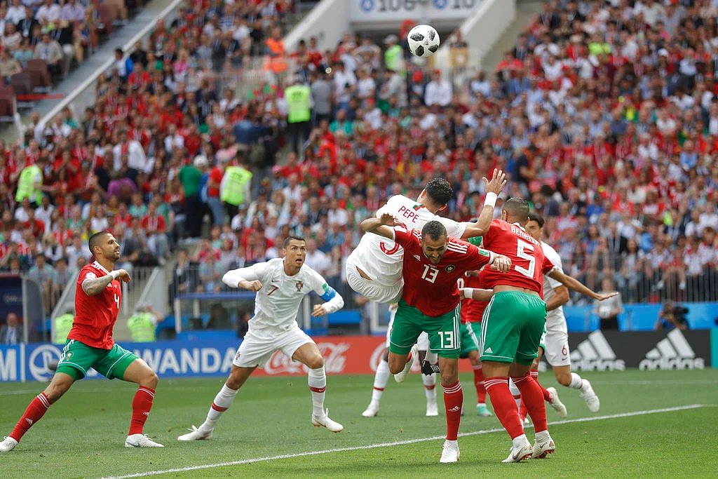 Cristiano Ronaldo sets up before heading in the deciding goal in Portugal’s win over Morocco on Wednesday, 20 June