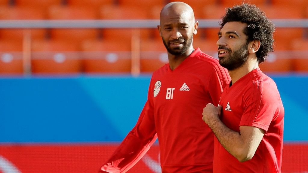 Egypt’s Mohamed Salah (right) and teammate Shikabala talk during Egypt’s training session on the eve of their Group A match against Uruguay.
