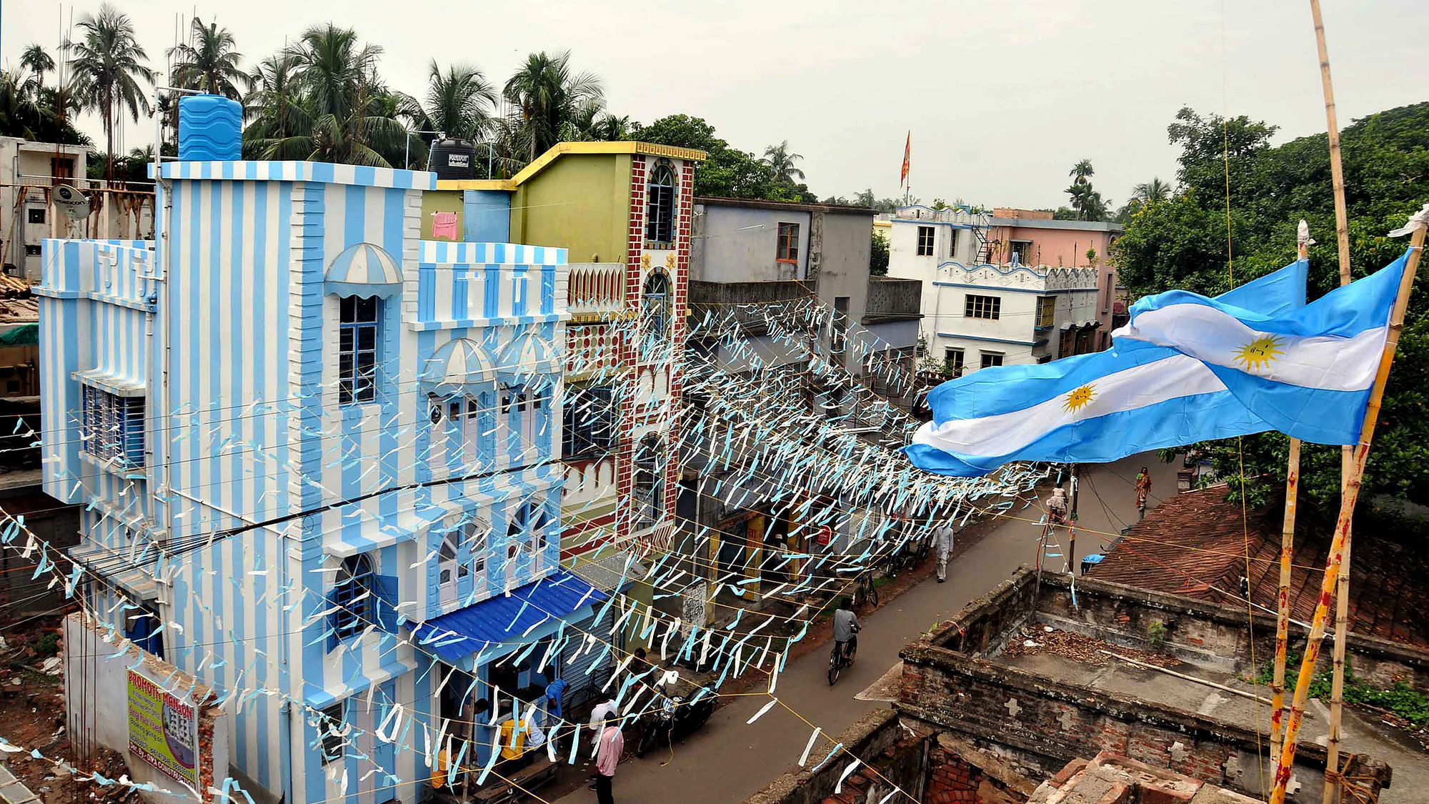 A view of tea-seller and die-hard Lionel Messi fan, Shib Shankar Patras three-storeyed apartment painted in blue-and-white ahead of FIFA World Cup 2018.