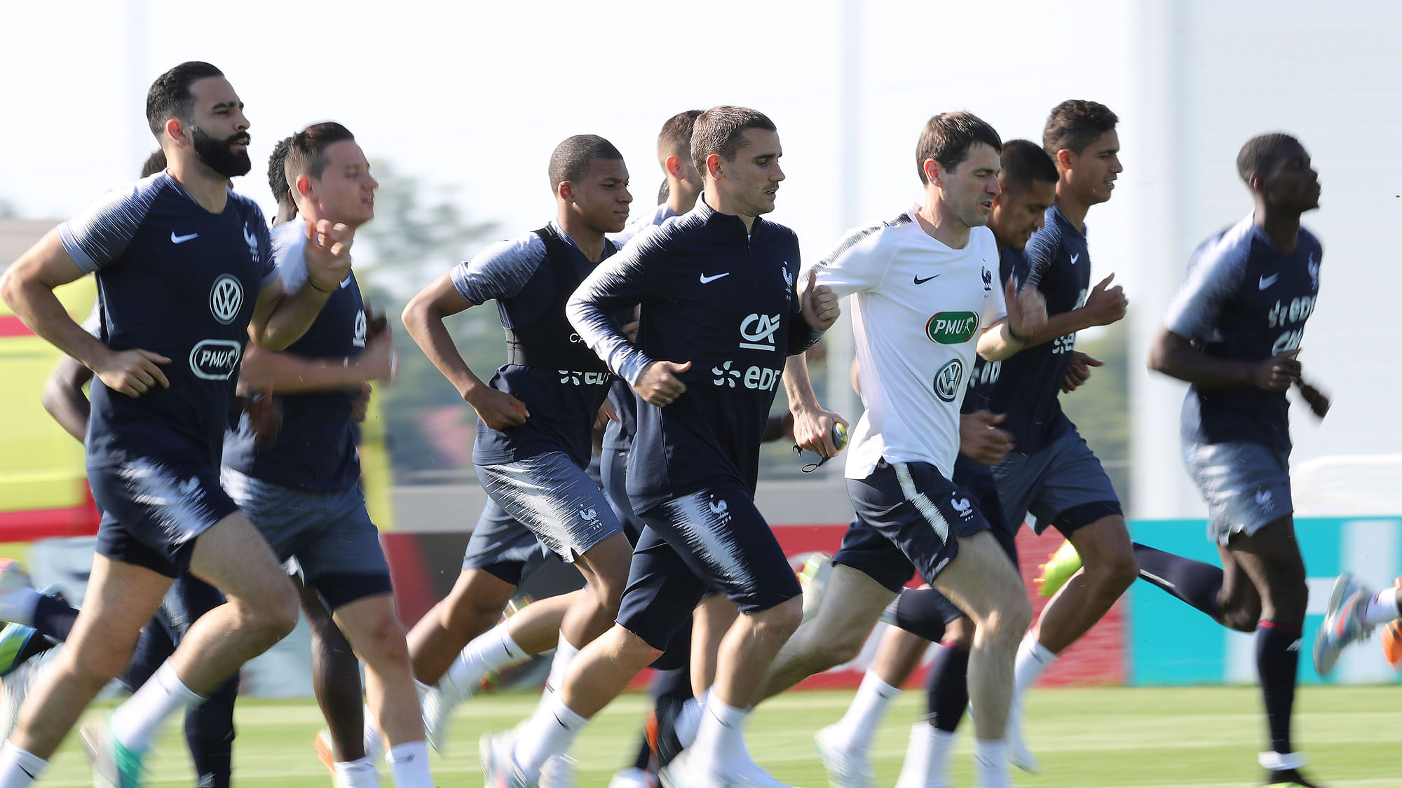 France’s Antoine Griezmann runs on the field during a training session.