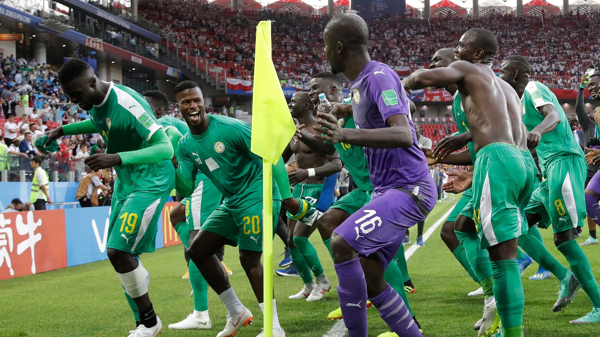 Senegal’s team players celebrate as they won the group H match between Poland and Senegal at the 2018 soccer World Cup in the Spartak Stadium in Moscow, Russia, Tuesday, June 19, 2018.&nbsp;