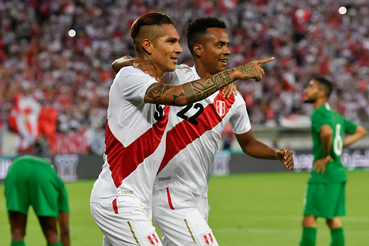 Peru’s Paolo Guerrero, and Pedro Aquino, from left, react after Guerrero scored during a friendly soccer match between Saudi Arabia and Peru.