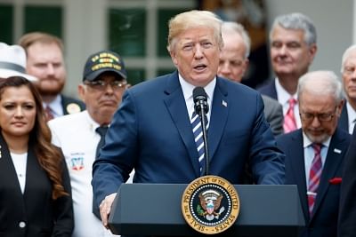 WASHINGTON, June 6, 2018 (Xinhua) -- U.S. President Donald Trump (Front) speaks during a bill signing ceremony for the "VA Mission Act of 2018" in the Rose Garden of the White House in Washington D.C., the United States, on June 6, 2018. (Xinhua/Ting Shen/IANS)
