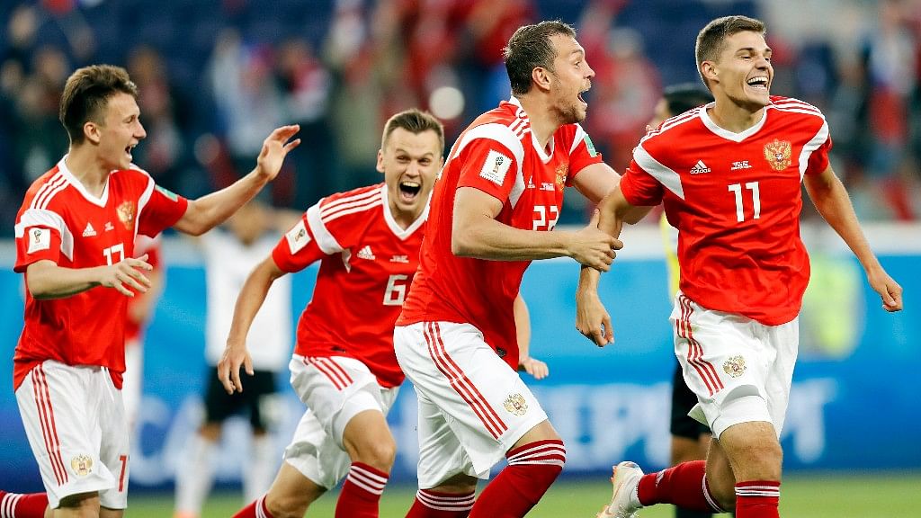 Host Russia reached the knockout phase for the first time since the collapse of the Soviet Union.