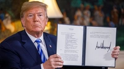 US President Donald Trump displays a signed presidential memorandum at the White House in Washington DC, the United States, on 8 May.&nbsp;