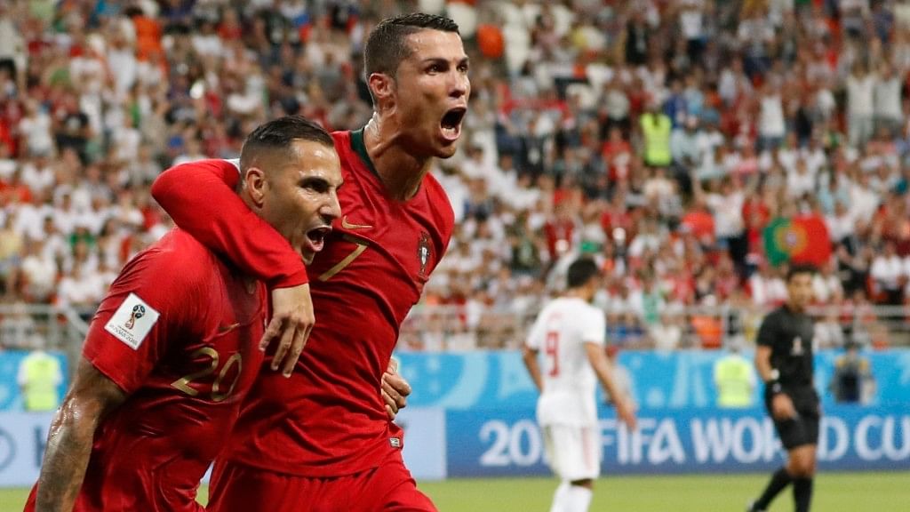 Ricardo Quaresma (left) celebrates with Ronaldo after he scored Portugal’s only goal against Iran in their Group B match on Monday.