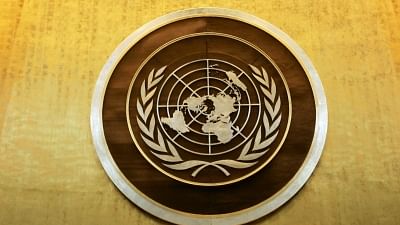 Plaque bearing the United Nations logo above the podium of the General Assembly Hall. Image used for representation only.