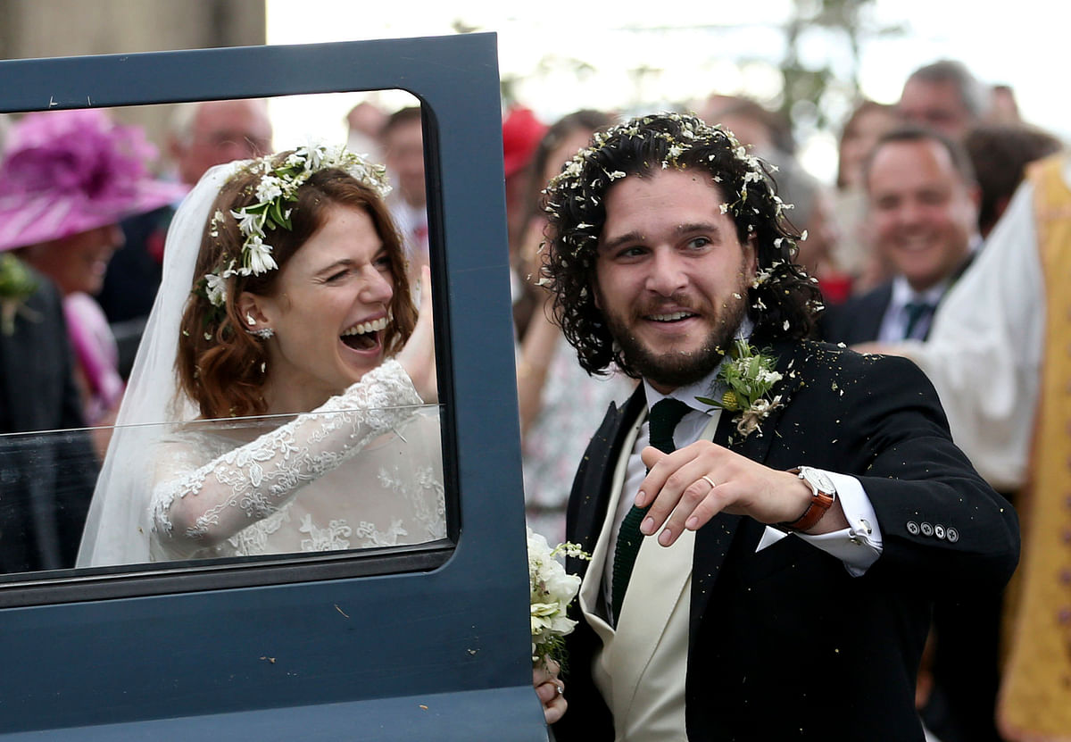 Fan causes frenzy on social media as she hides behind a bush to film Kit Harrington and Rose Leslie’s wedding. 