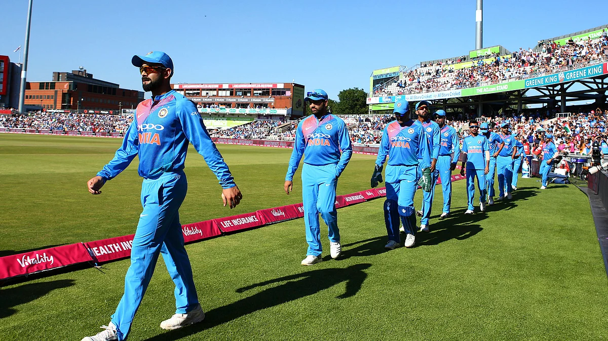 Virat Kohli leads his team onto the field for the first T20 against England.