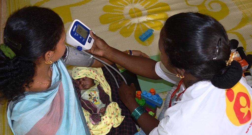 A lactating mother is being checked for blood pressure at the daycare center in Godiguda village in Araku Valley&nbsp;