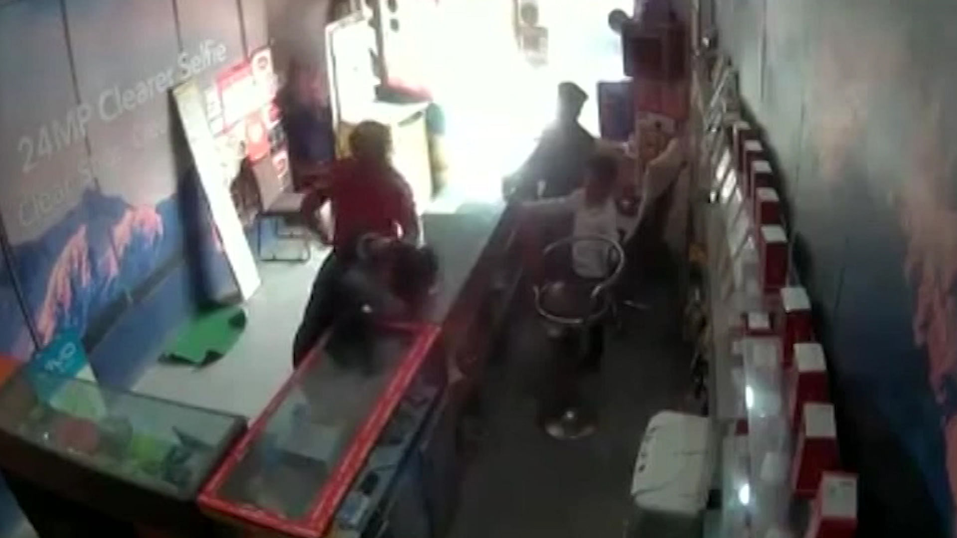 CCTV captures a minor being thrashed inside a mobile store