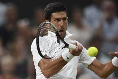 LONDON, July 14, 2018 (XINHUA) -- Novak Djokovic of Serbia hits a return during the men