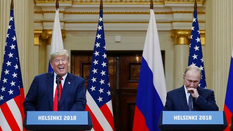 US President Donald Trump (L) with Russia’s President Vladimir Putin